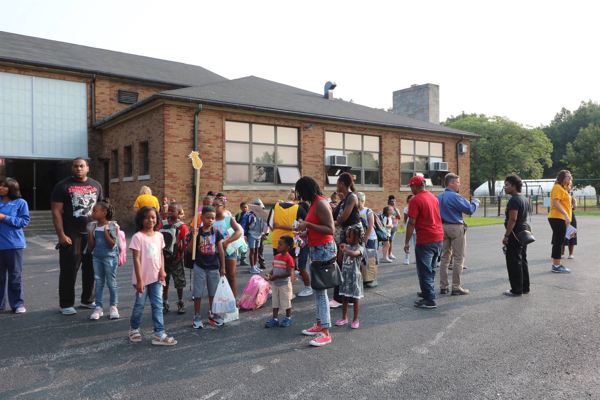 Students gathering outside of school building