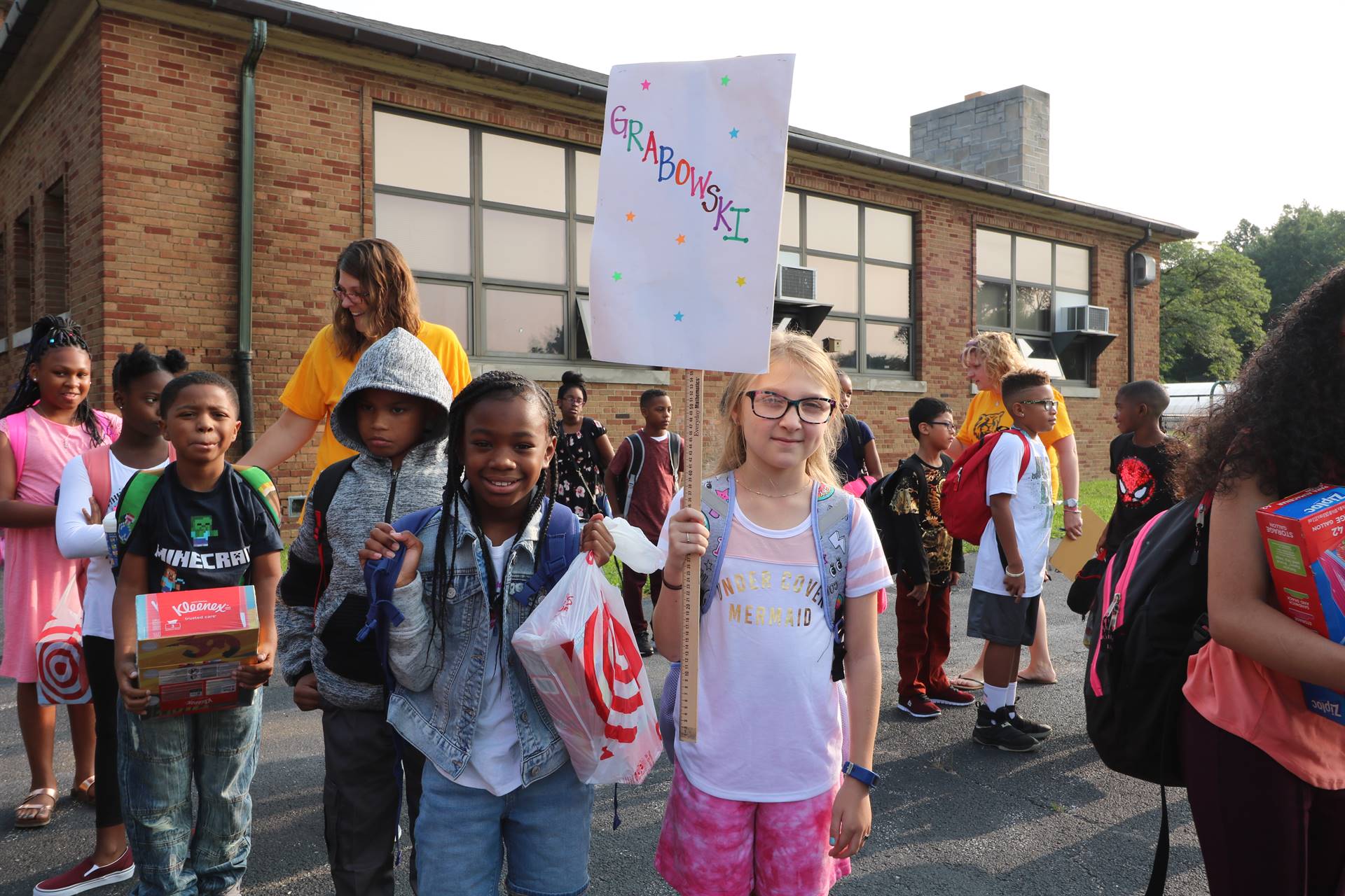 Students gathering outside of school building