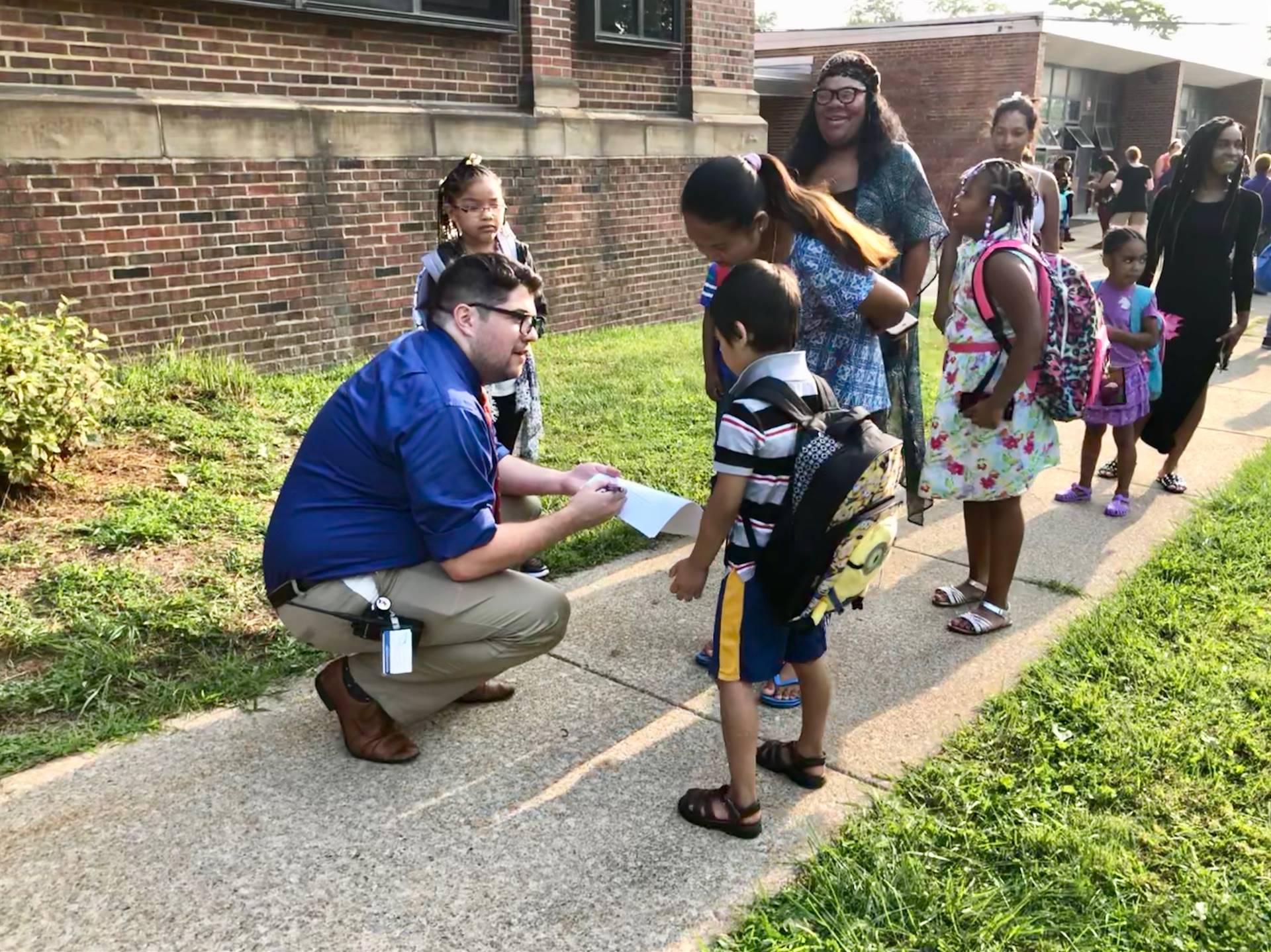 Principal talking to students outside