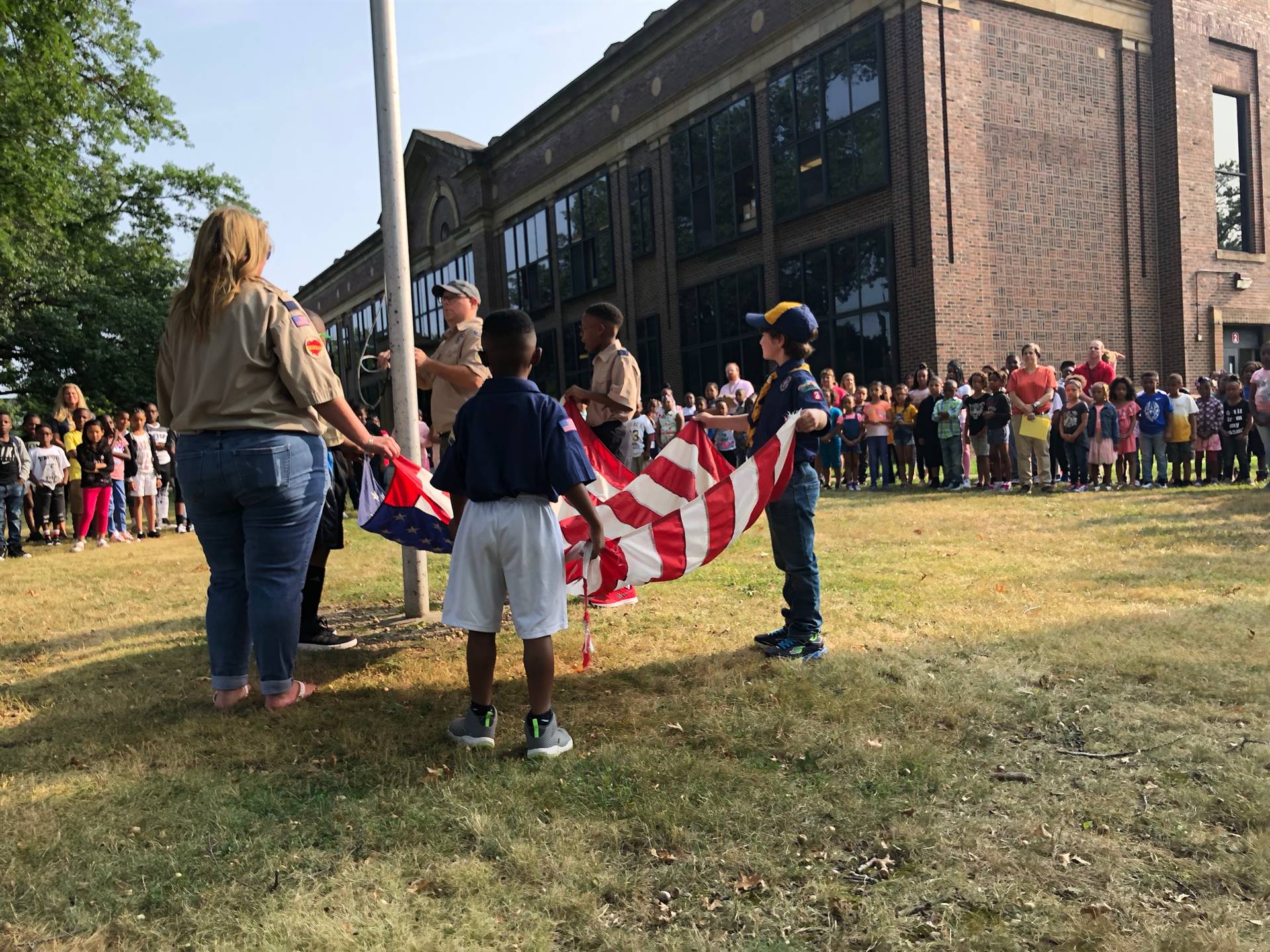 Scouts raising flag