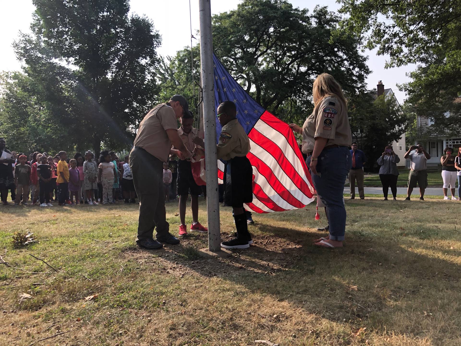 Scouts raising flag