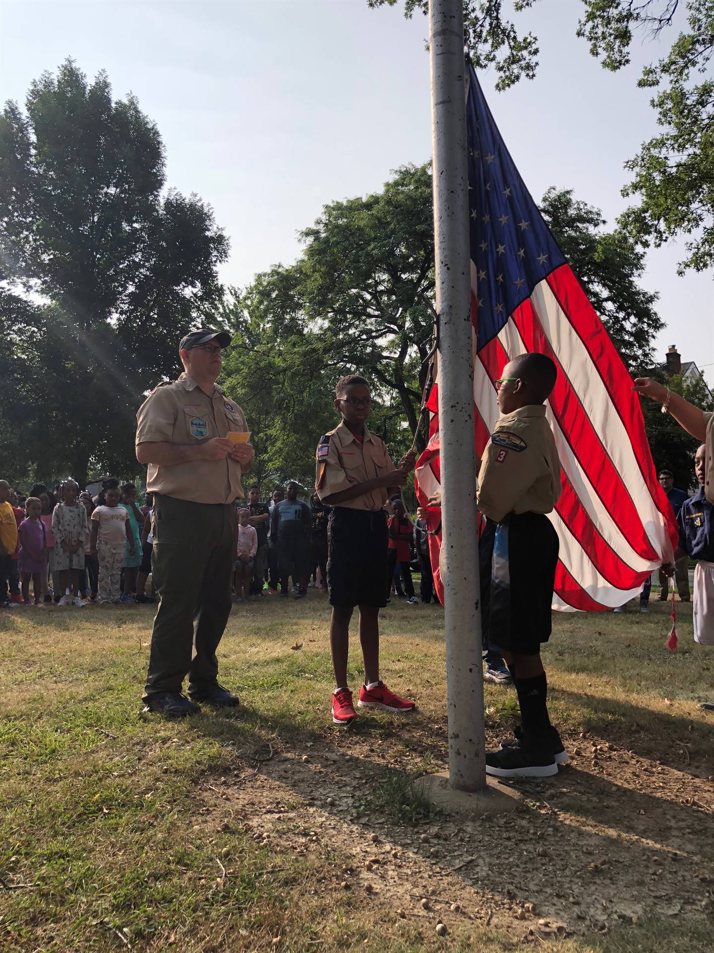 Scouts raising flag