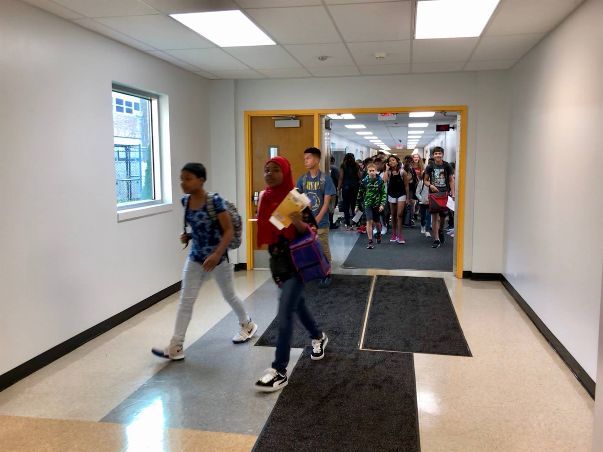 Students walking through hallway