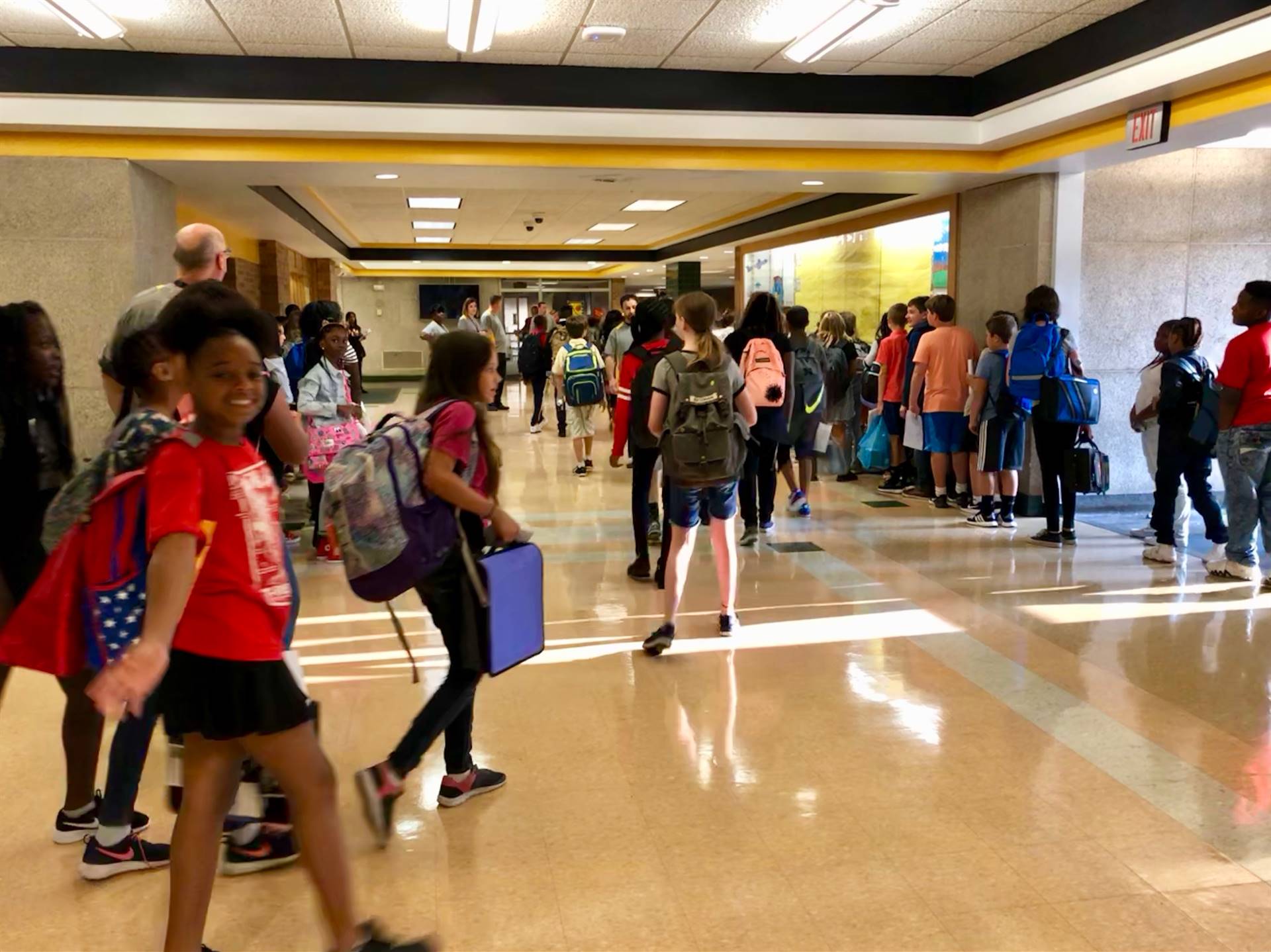 Students walking through hallway