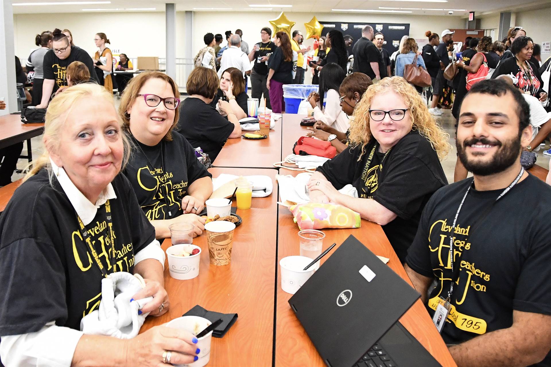 Staff smiling at table