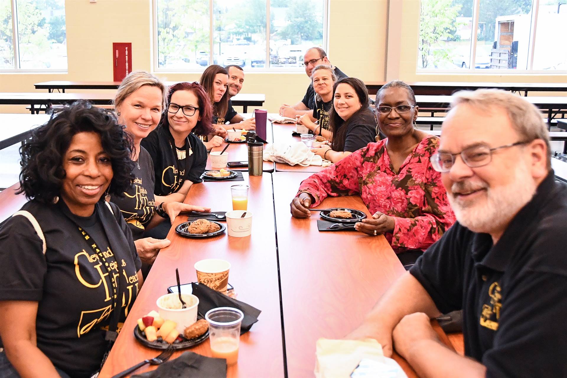 Staff smiling at table