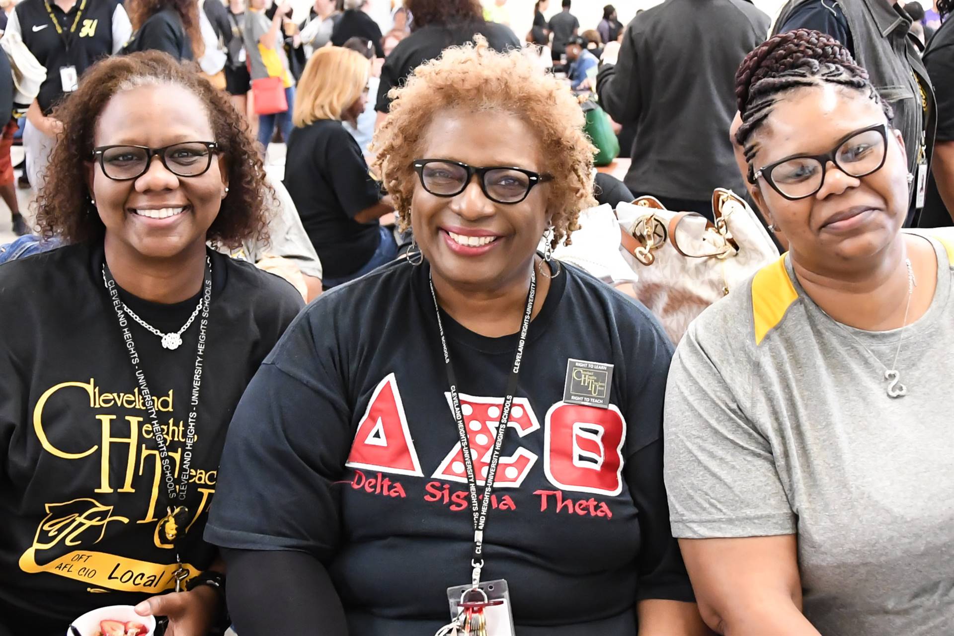 Three staff members smiling