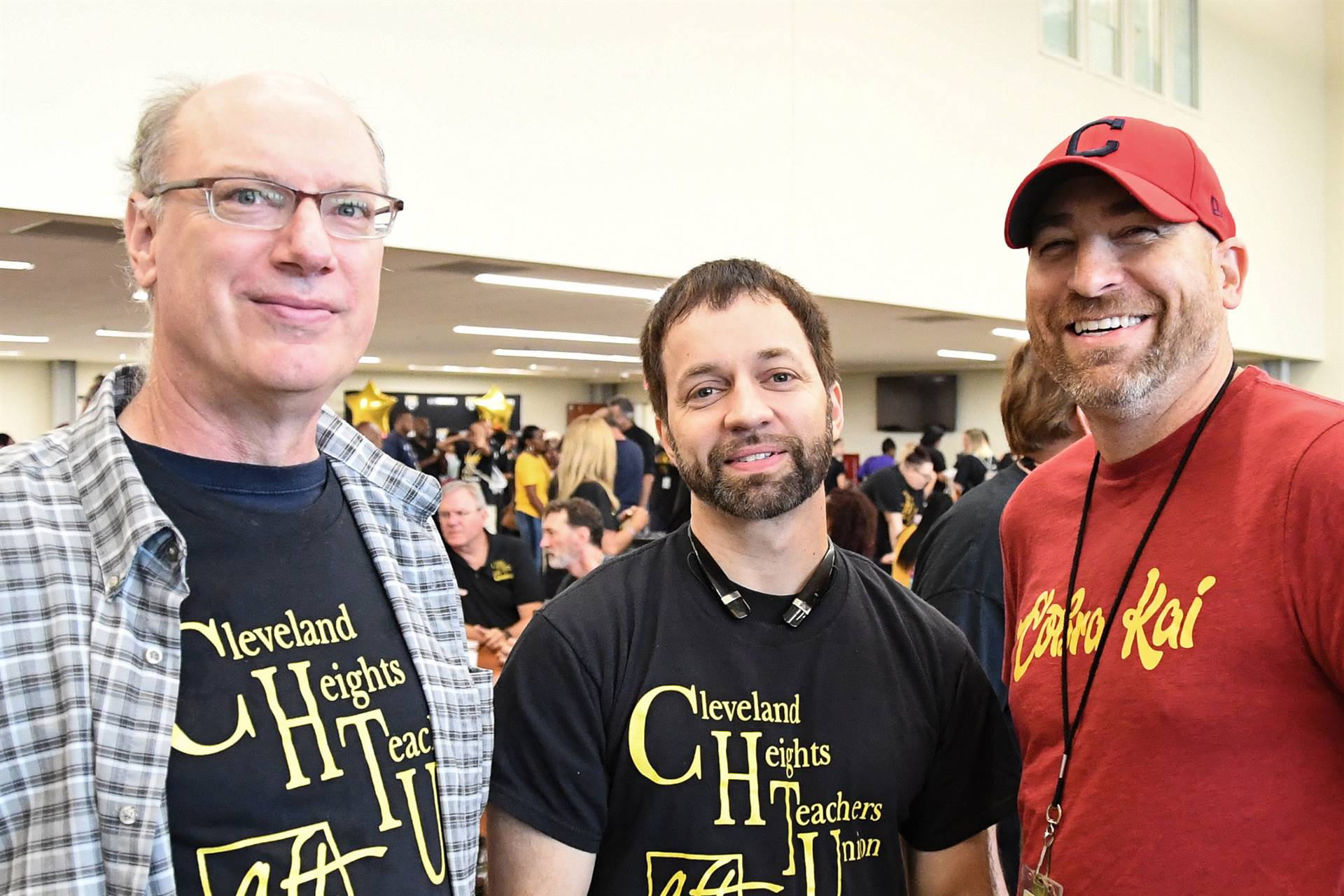 Three staff members smiling