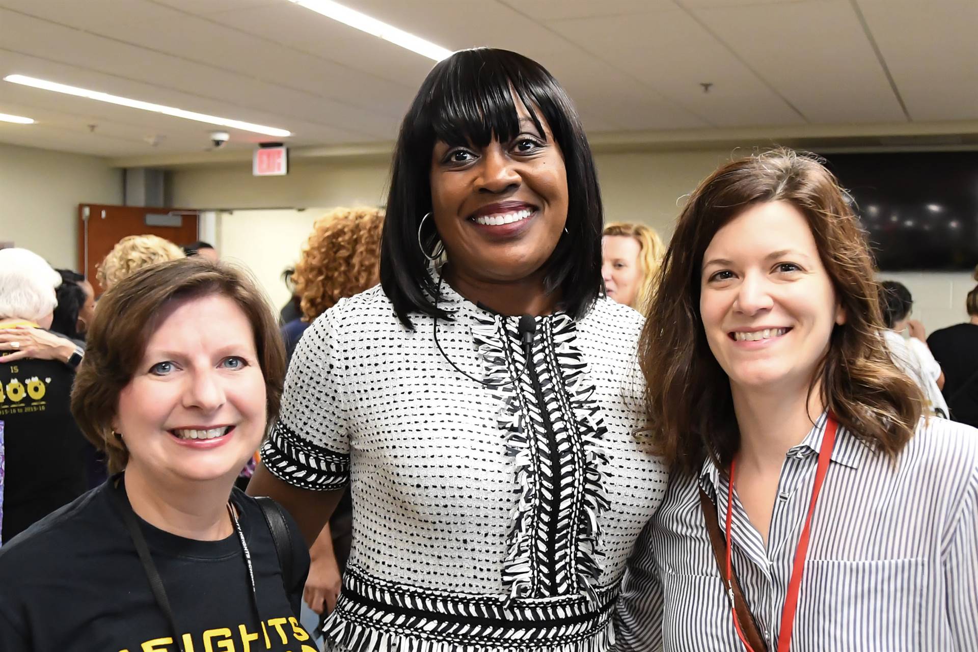 Three women smiling