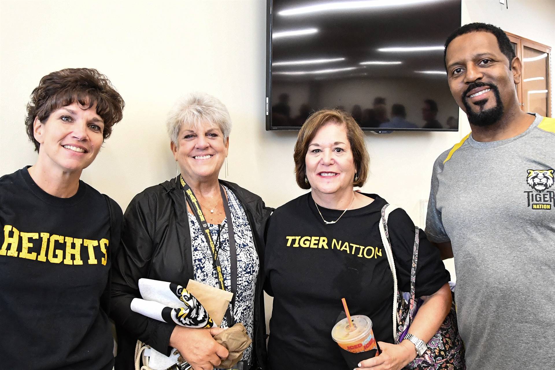 Four staff members smiling