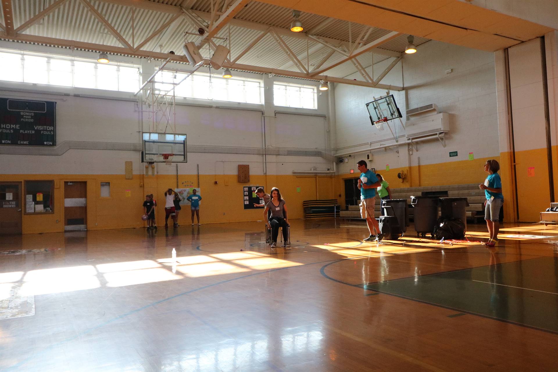 Students playing game with chairs and balloons