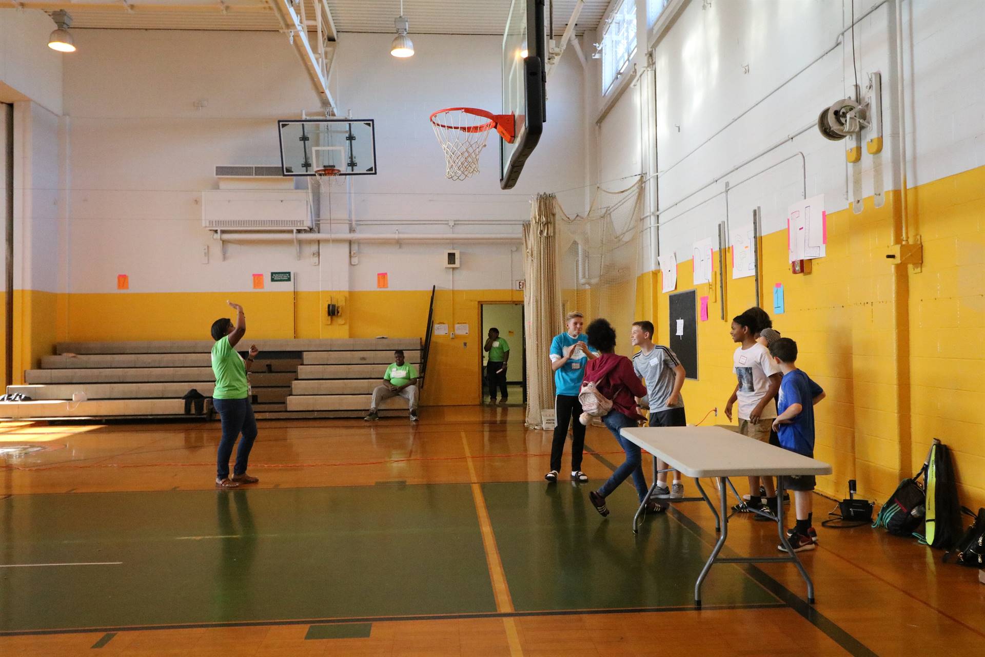 Students playing game with chairs and balloons