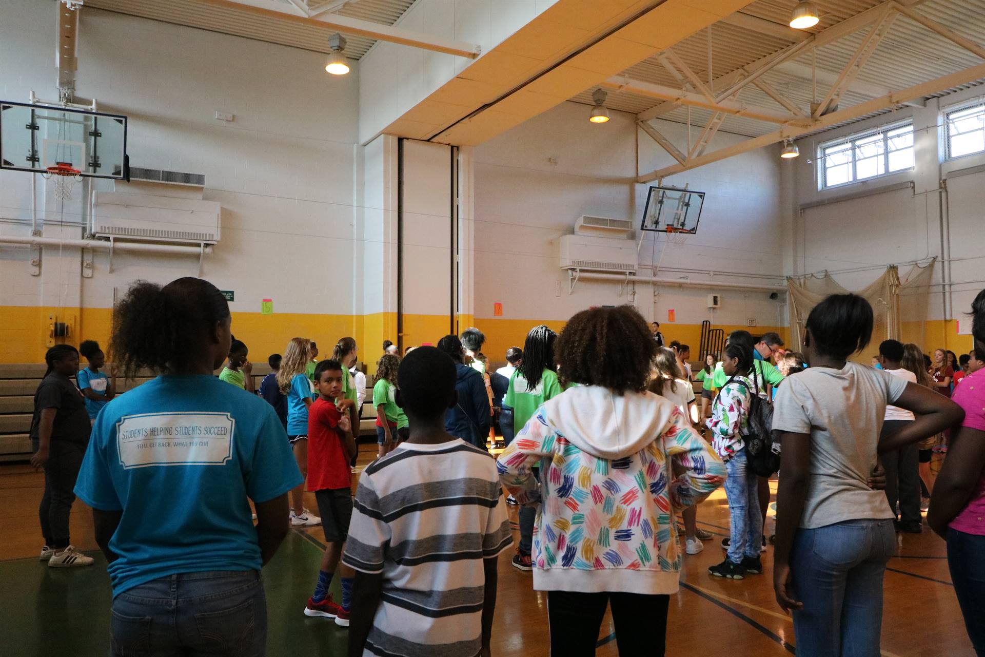 Students gathered on gym floor