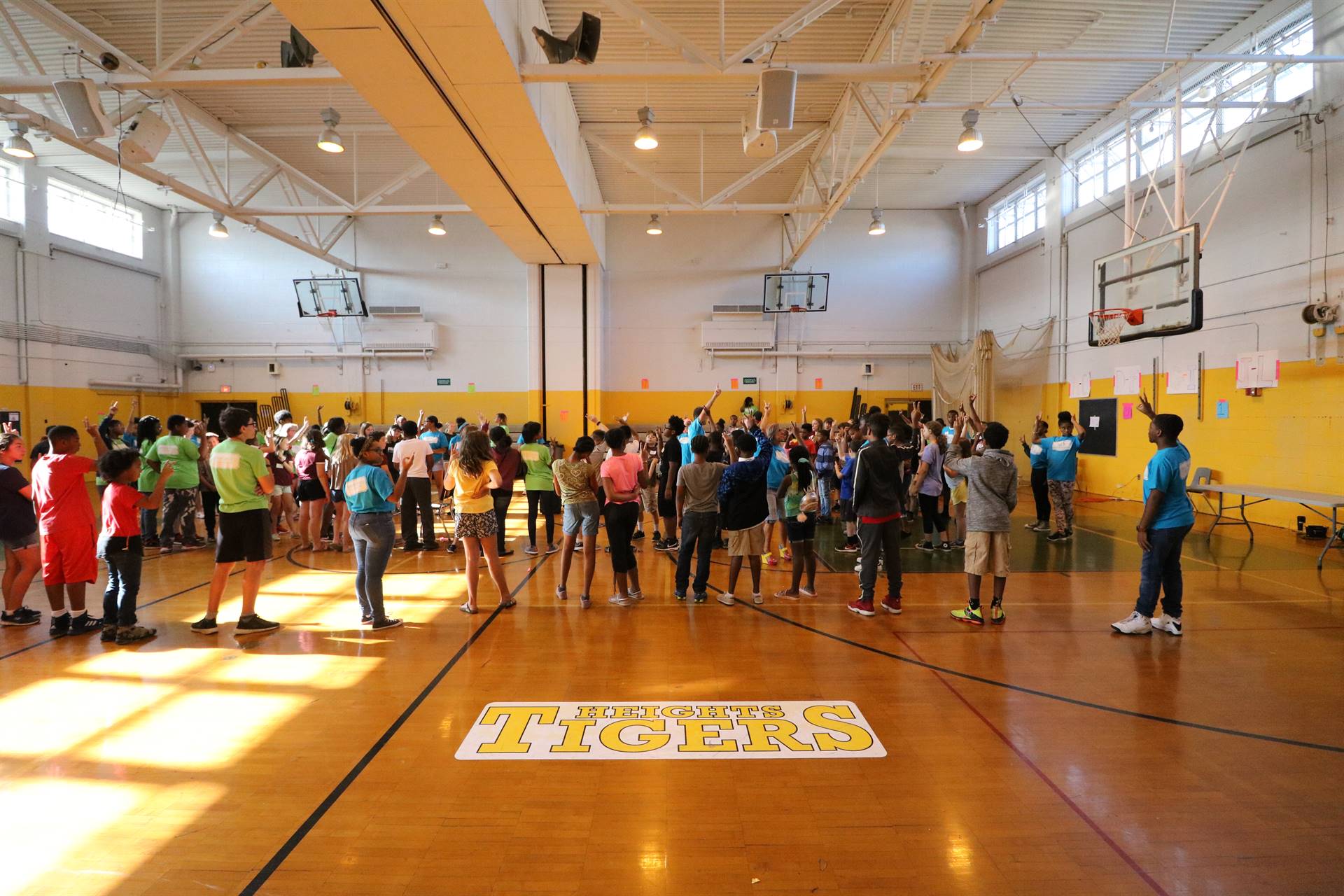 Students gathered on gym floor
