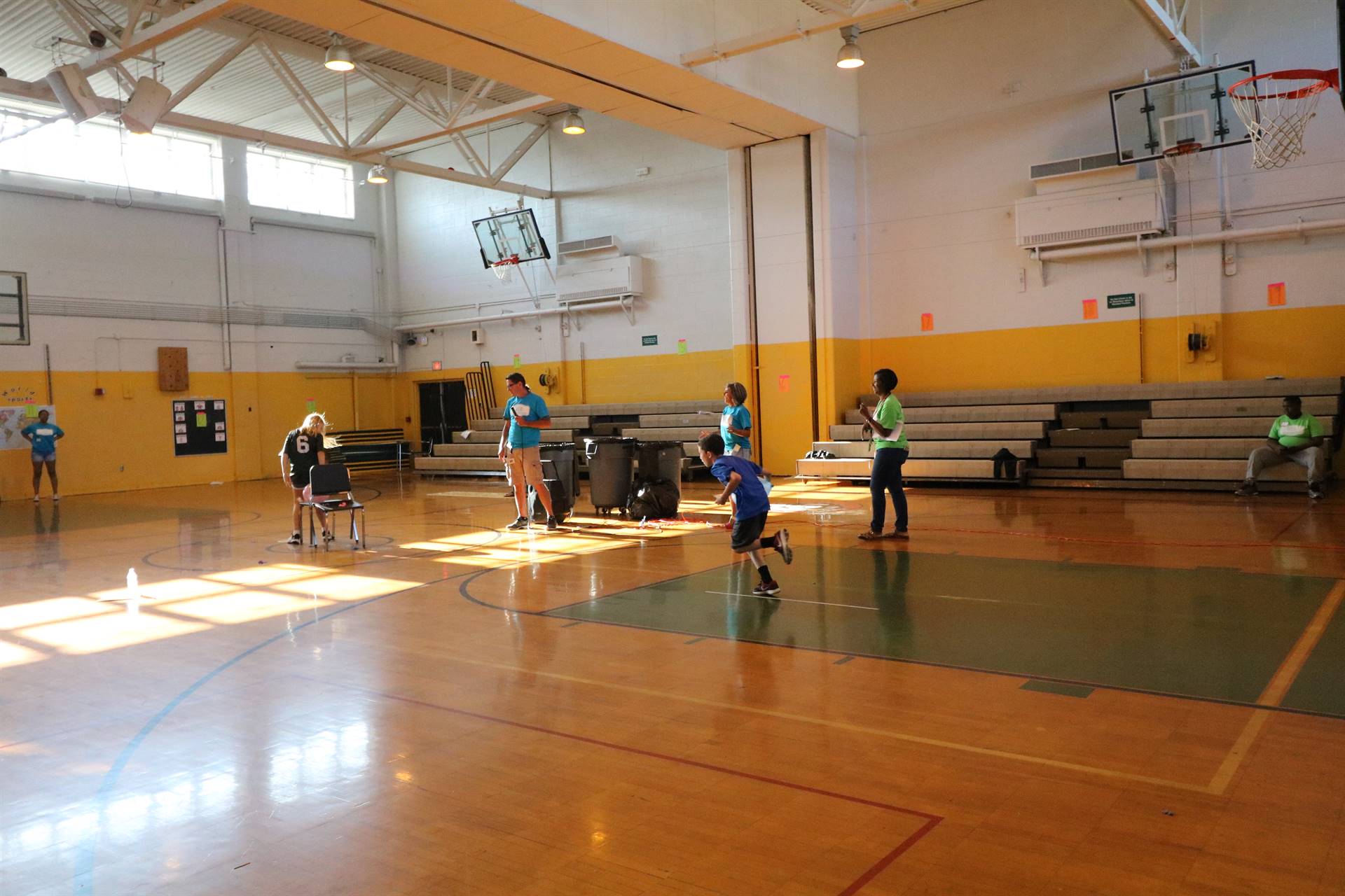 Students playing game with chairs and balloons