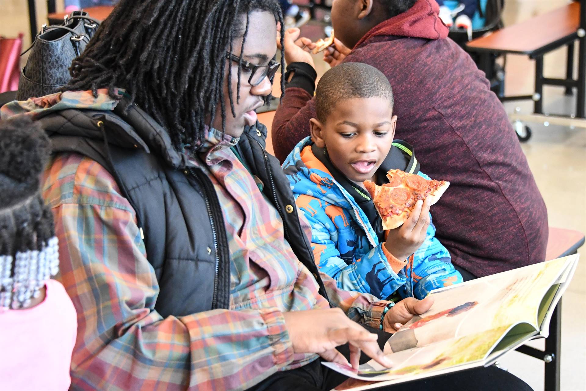 Woman and child reading a book