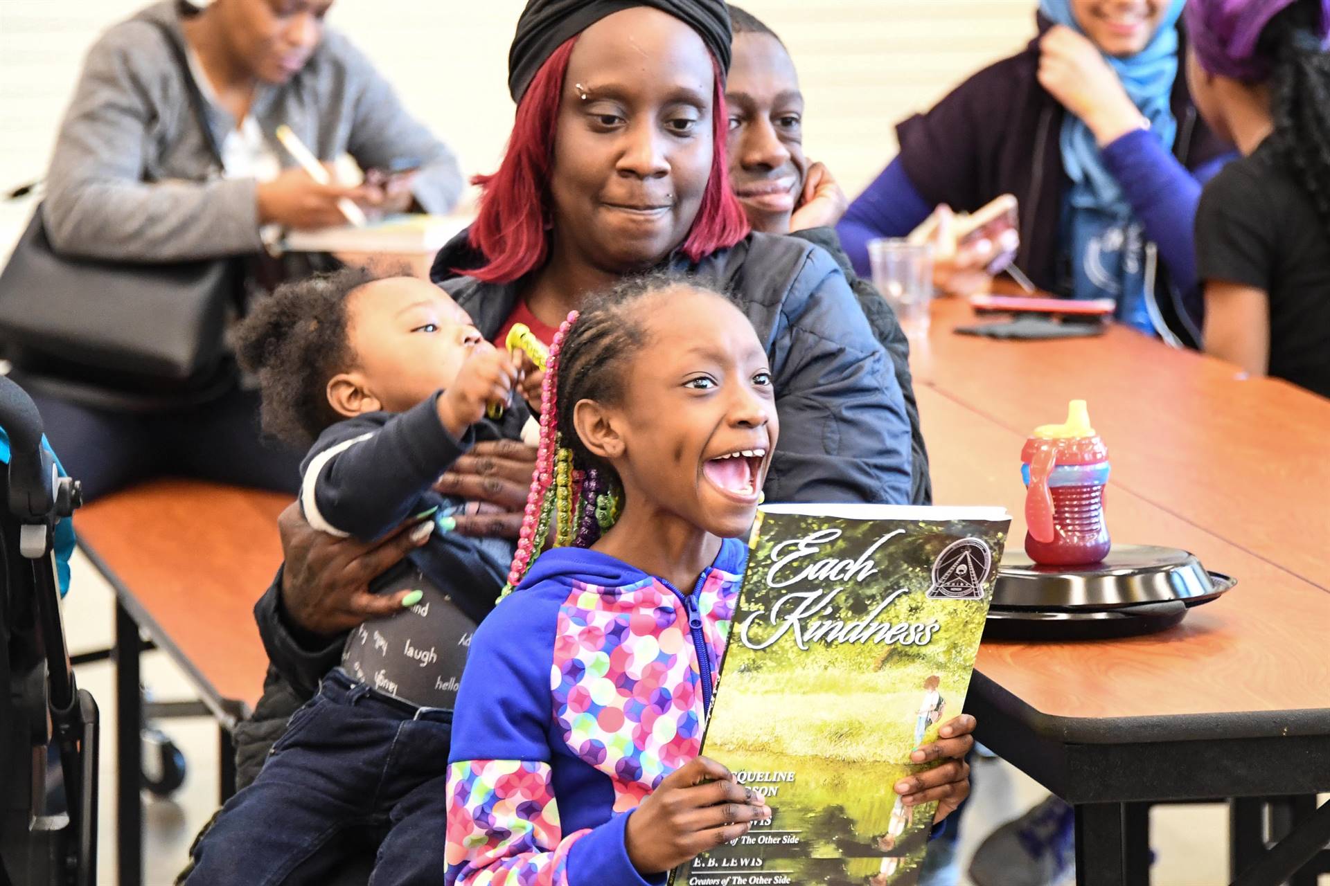 Girl smiling with book