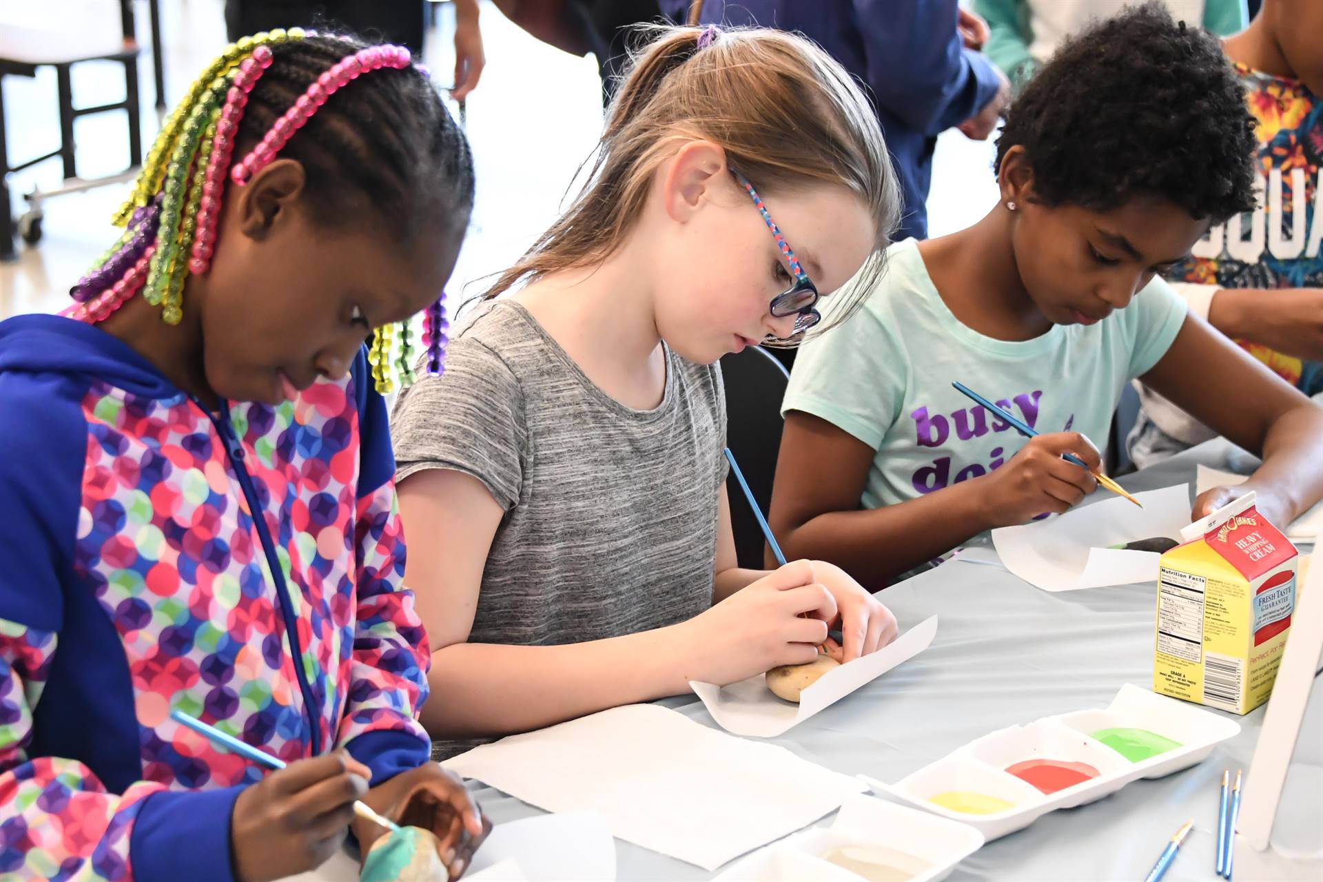 Kids painting eggs