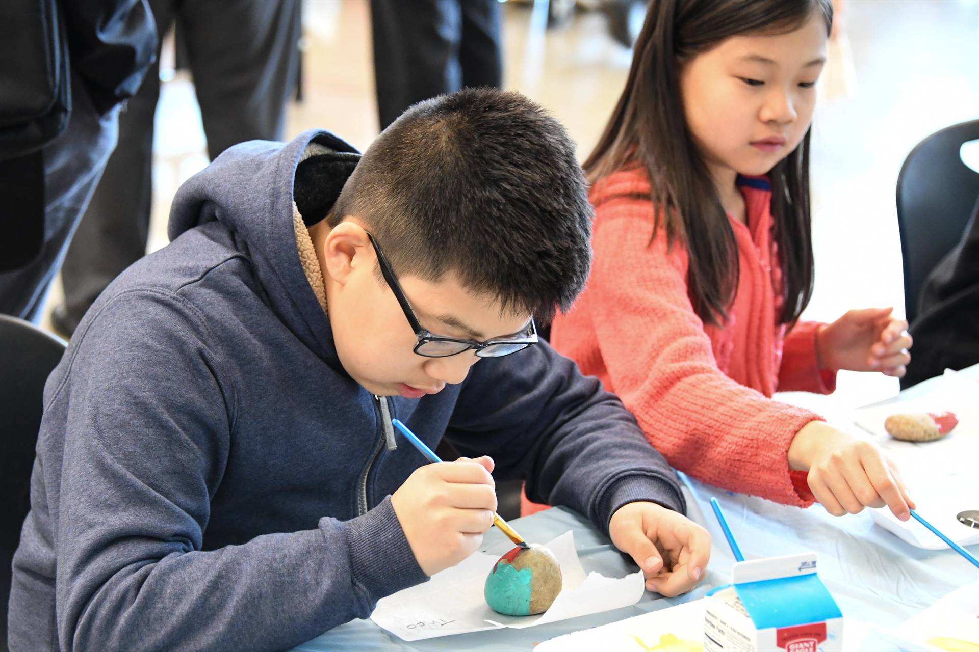 Boy painting egg