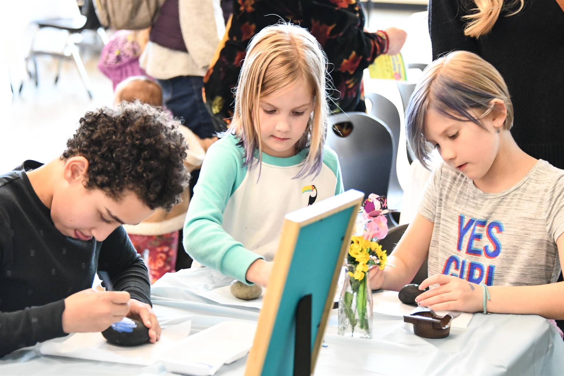 Children painting eggs