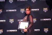 staff member holding award